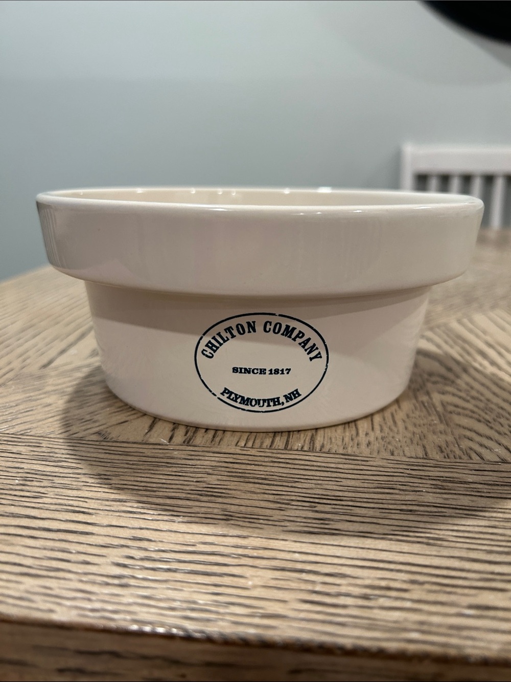 Pottery Barn Cream Ceramic dog bowl with Blue Logo
